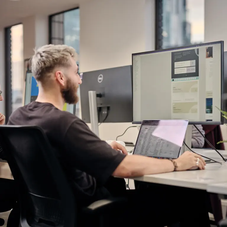 Cantarus team member working on a pc