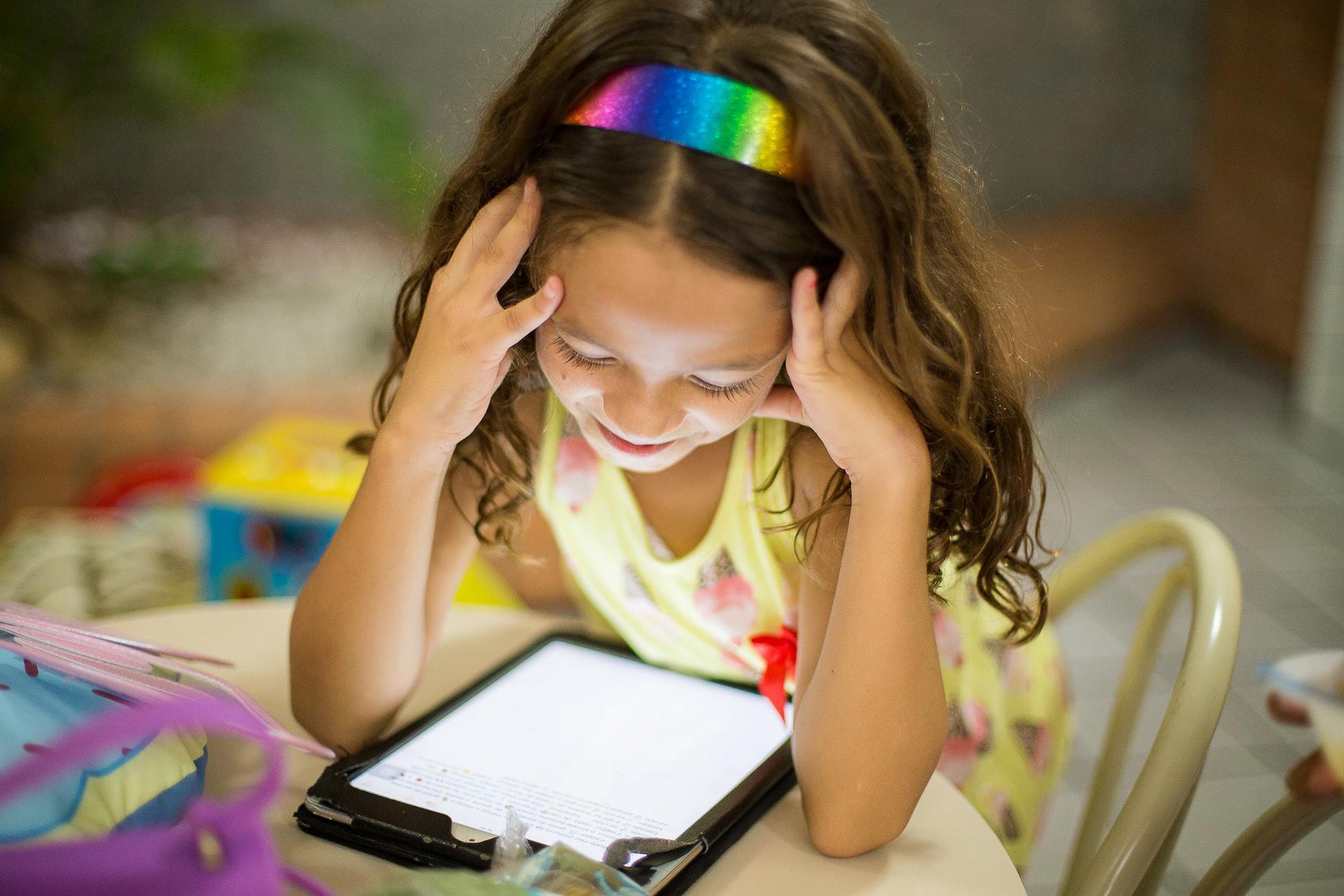 young child using a tablet