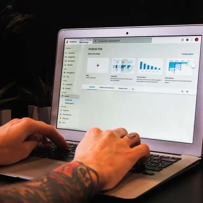 person typing on laptop