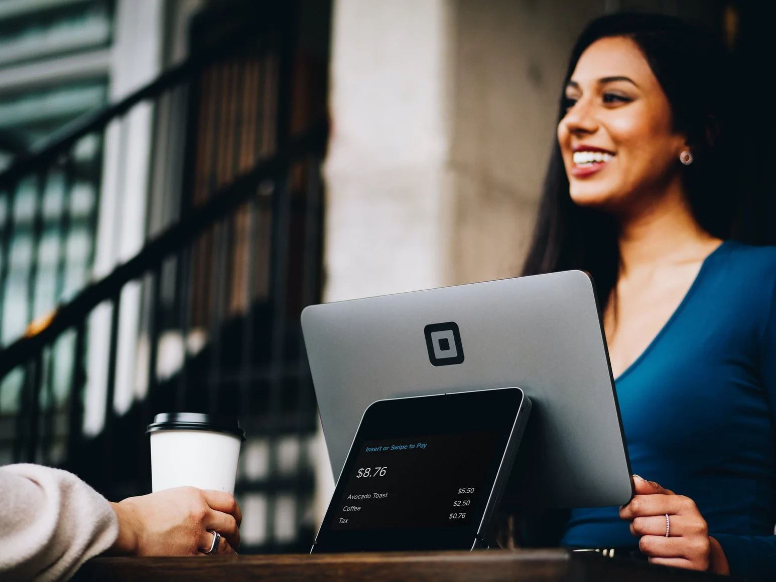 Person smiling over laptop
