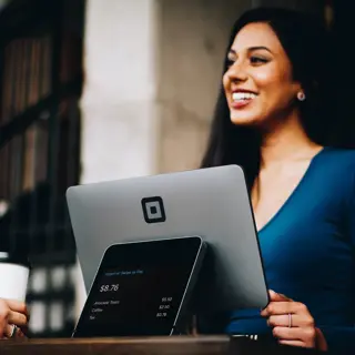Person smiling over laptop