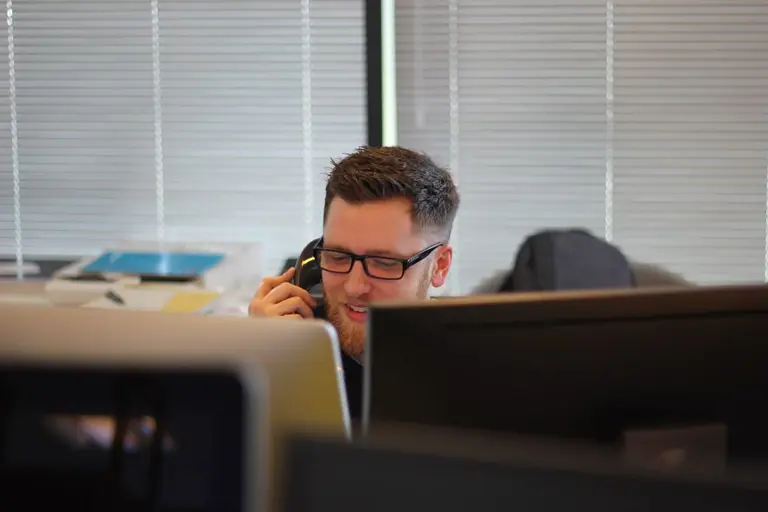 Man on phone at desk