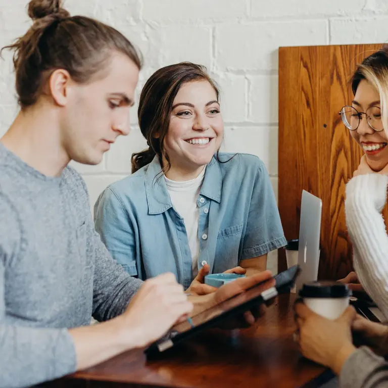 group of four people in a meeting