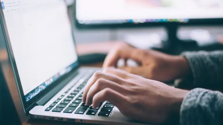 typing on a laptop