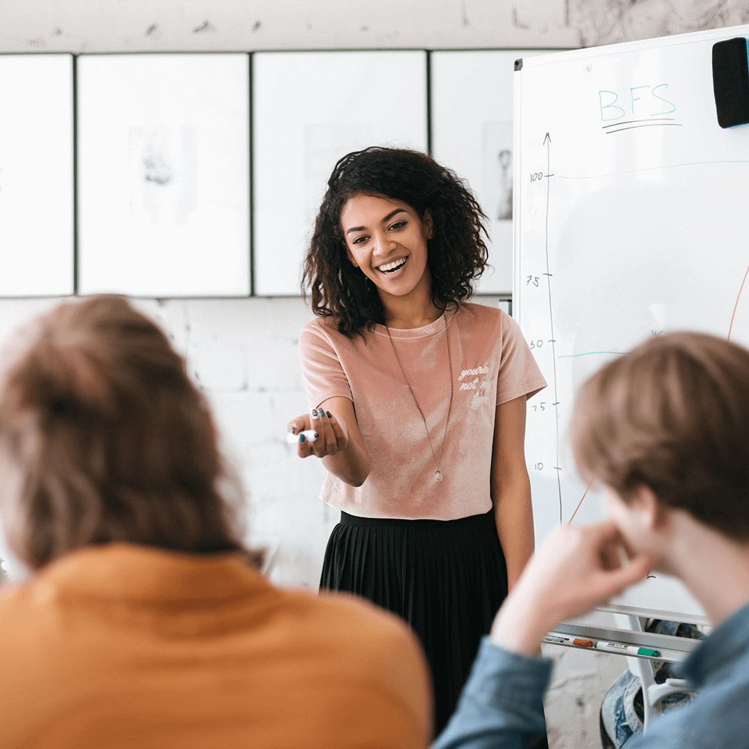 person presenting at front of room