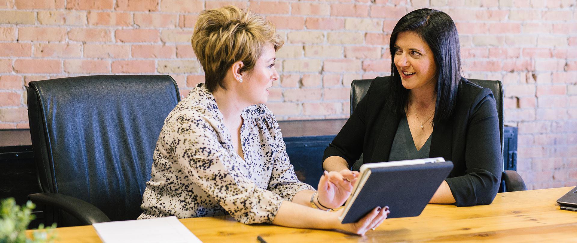 Two people discussing pension management
