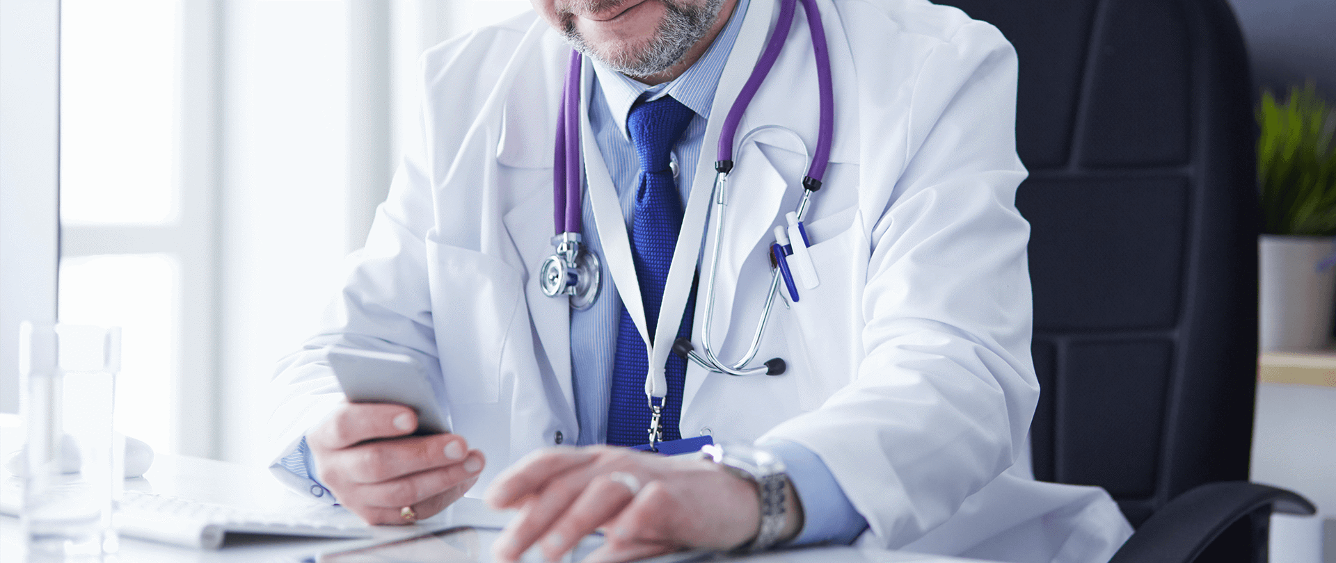 Royal College of GP doctor looking at app