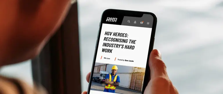 Driver reading article on mobile version of Road Haulage Association website