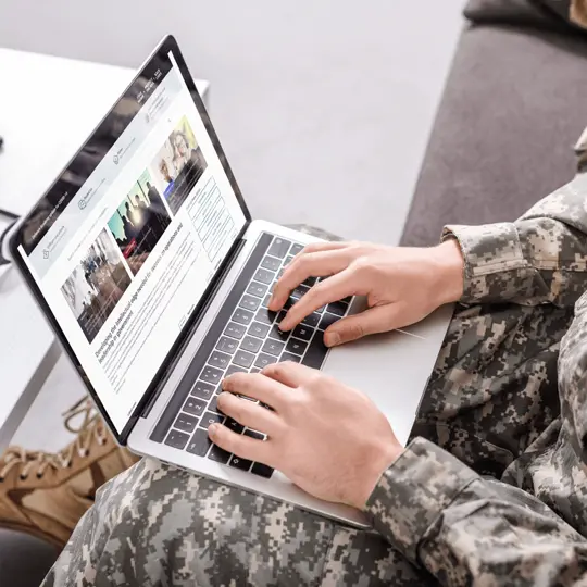 Soldier accessing information on the Serco website