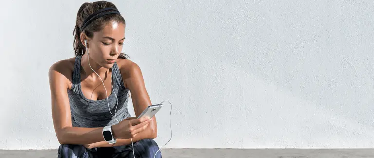 Woman browsing Sports Direct store on mobile device