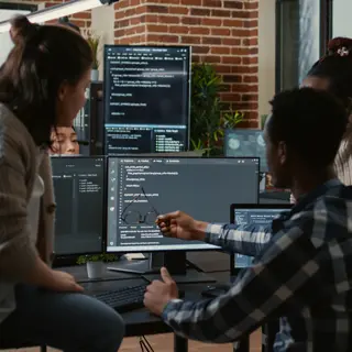 People reviewing code together